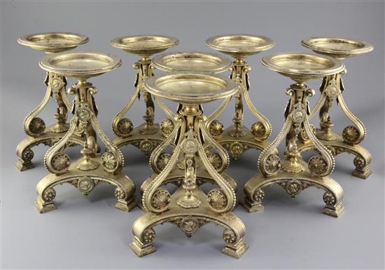 A set of eight Victorian gilt metal comport stands by Cartwright & Woodward, height 9.25in.